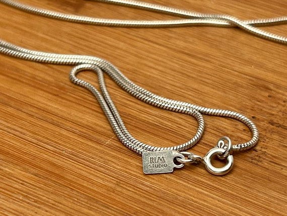 The RLM mark, photographed on a piece