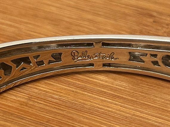 The Belle mark, photographed on a piece