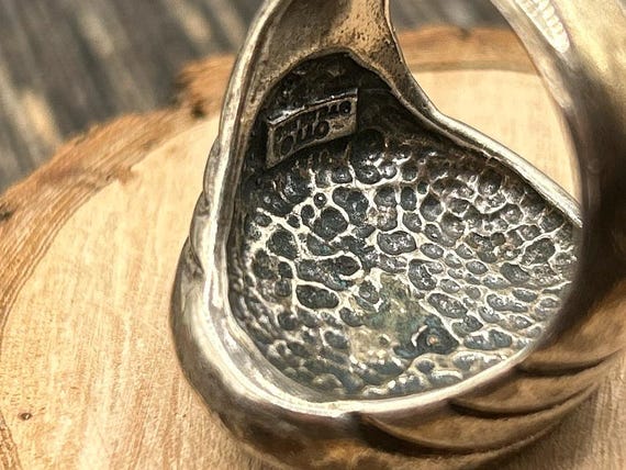 The OTT mark, photographed on a piece