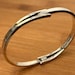 Mid century sterling silver bangle — view 1 of 10