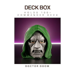 May include: A Doctor Doom deck box featuring a silver metallic mask with visible rivets and a textured green hood. The text DECK BOX, HOLDS 100+ COMMANDER DECK, and DOCTOR DOOM are printed on the image. The design depicts a character head.