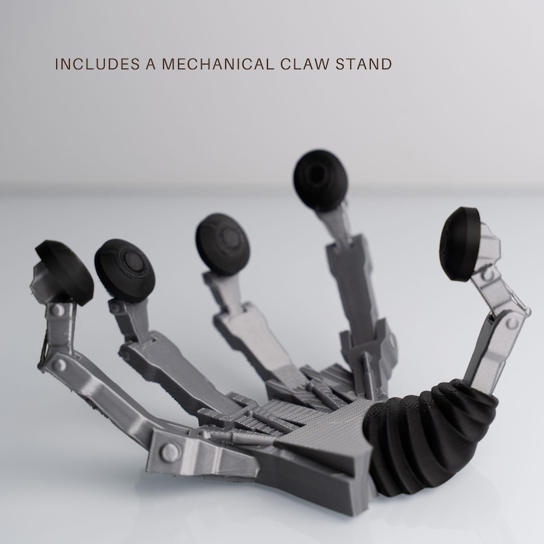a mechanical claw stand with a mechanical design, including a claw-like structure and various mechanical components.