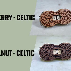 May include: Two wooden dice with a Celtic knot design. The dice are made of cherry and walnut wood. The dice are numbered 20.
