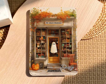 May include: A rectangular illustration of "Mr. Ghost's Bookstore" with a ghost in the doorway, a carved pumpkin, and a wooden chair. The bookstore has shelves of books, and the name "Daisy" is written in cursive.