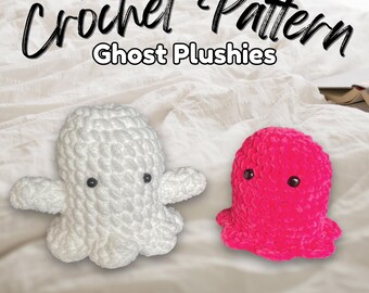 May include: Easy crochet pattern for ghost plushies. Two crocheted ghost plushies, one white and one pink, are lying on a white bedspread. The text "Halloween Amigurumi" is at the bottom of the image.