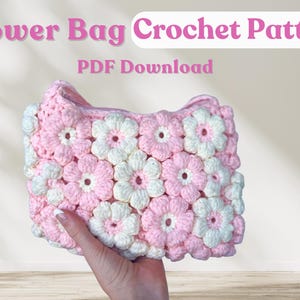 May include: A crochet bag pattern featuring a pink and white flower design. The pattern is available as a PDF download.  Flower Bag Crochet Pattern PDF Download