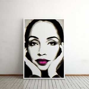 May include: A black and white portrait of a woman with pink lips. Her hands are resting on her cheeks. The background is a light grey.