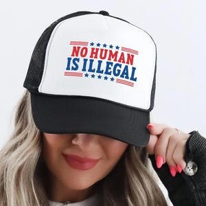 No Human Is Illegal Trucker Hat, Liberal Protest Snapback, Immigrant Rights Mesh Cap, Anti-Racist Statement Hat, Justice Activist Gear