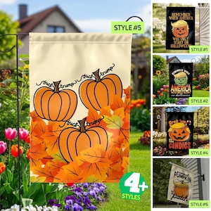 May include: A rectangular garden flag featuring three orange pumpkins resting on a bed of orange and yellow autumn leaves. The text "fuck trump" is written in black cursive script above and between the pumpkins. Five additional flag styles are shown.