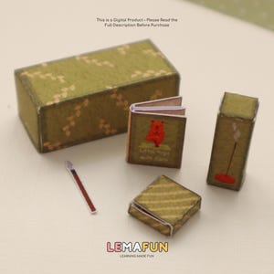 Pu&ograve; includere: Un set in miniatura a tema yoga con una combinazione di colori verde e oro. Il set include una scatola rettangolare, un piccolo libro intitolato "Little Yoga with Coco", una scatola quadrata, un bastoncino di incenso e un pennello. Il testo "LEMAFUN" &egrave; visibile.