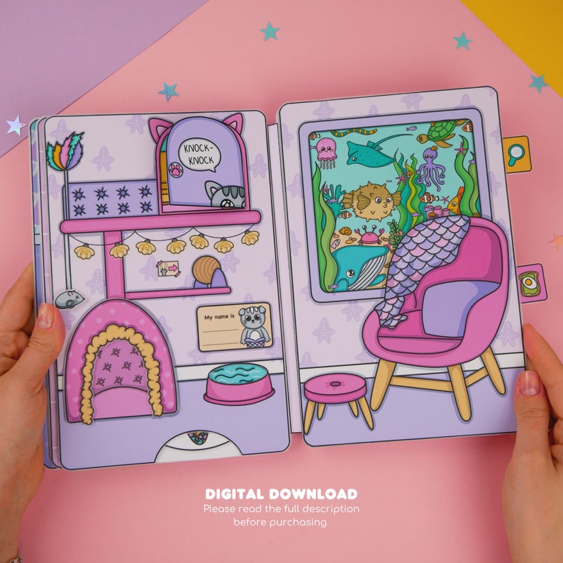 Puede incluir: Una descarga digital imprimible de un libro de actividades de dos p&aacute;ginas para ni&ntilde;os. La p&aacute;gina izquierda presenta un &aacute;rbol para gatos con un gato en una ventana, un taz&oacute;n de agua y una etiqueta de nombre. La p&aacute;gina derecha presenta un sill&oacute;n rosa con una cola de sirena, una pecera con varias criaturas marinas y un peque&ntilde;o taburete.