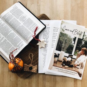 May include: A family guide to a Christ-centred Advent with the text "Come and Behold" and the hashtag "#gathergospelgrowco".
