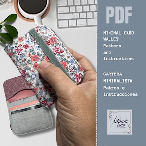 May include: A floral print card wallet with a green elastic band, held in a hand. The wallet is open, revealing card slots. The image also shows a PDF document with instructions for making a minimal card wallet.