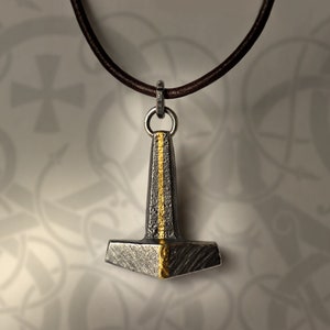 Mjölnir Golden Ray Pendant: solid Sterling silver and 24k gold Thor&#39;s hammer with leather cord. Handmade to order in Oslo, Norway.