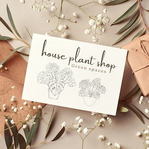 K&ouml;nnte beinhalten: Eine wei&szlig;e Karte mit schwarzem Text, der "house plant shop Green spaces" lautet, und zwei Strichzeichnungen von Topfpflanzen.