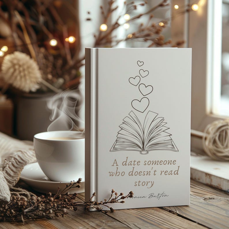 May include: A white book with a black and white illustration of an open book with hearts floating above it. The text on the book reads "A date someone who doesn't read story".