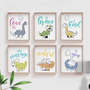 May include: Six printable wall art prints featuring colourful dinosaurs with inspirational messages. The prints include "Be Brave", "Be Kind", "Be You", "Be Grateful", "Have Courage", and "Love Dig".