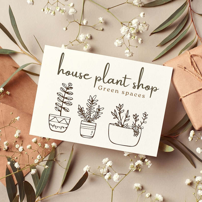 May include: A white card with black text that reads "house plant shop Green spaces". The card features three illustrations of potted plants.