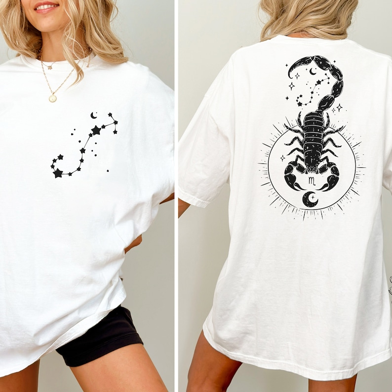 May include: White oversized t-shirt with a black scorpion constellation graphic on the front and a black scorpion with a crescent moon and stars graphic on the back.