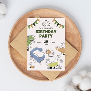 May include: A white card with green and brown dinosaur illustrations and the text "You Are Invited To Birthday Party Sunday 25 Nov At 8 PM".