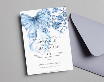 May include: A blue and white baby shower invitation with a watercolor bow and floral design. The invitation reads "You are invited to a Sprinkle Honoring Riley James, Monday, August 22, 2020, at 11 AM, James Residence, 123 Anywhere St., Any City, Registered at Amazon."