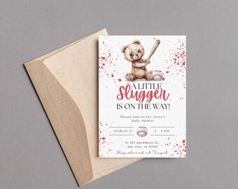 May include: A white baby shower invitation with red splatter paint and a cartoon teddy bear holding a baseball bat. The text reads "A Little Slugger is on the Way!" and includes details for the shower, including the date, time, and location. The invitation also states "Registered at Target."