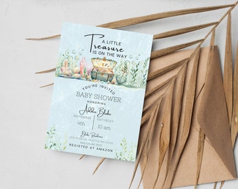 May include: A light blue baby shower invitation with a watercolor illustration of a treasure chest, sea life, and bubbles. The text reads "A Little Treasure Is On The Way" and includes the baby's name, date, time, and location. The invitation also states "Registered at Amazon".