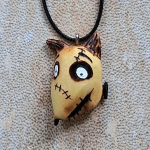 Strange dog pendant necklace with scars entirely hand carved from linden wood