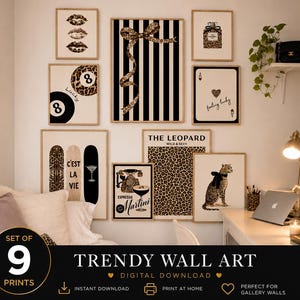 May include: A set of nine wall art prints featuring black, white, and leopard print designs. The collection includes illustrations of lips, a bow, a perfume bottle, an eight ball, playing cards, skateboards, a telephone, and a leopard.
