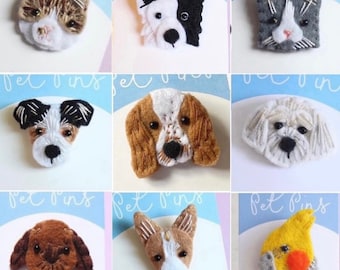May include: A collection of handmade pet pins featuring various dog and cat breeds, including a calico cat, a black and white dog, and a gray cat. Each pin is intricately crafted with detailed stitching and soft textures, showcasing the unique features of each animal.