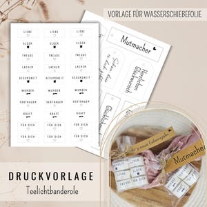 May include: Printable templates for tea light candle rolls and water slide decals. The designs feature German words such as "love," "joy," and "health," alongside gift tags. The image also shows packaged tea light rolls, ready for gifting.