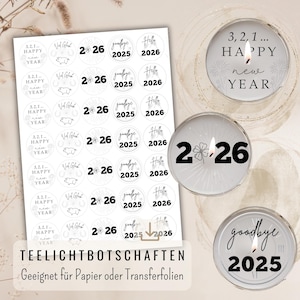 May include: A selection of New Year's Eve themed candle stickers and lit candles. The stickers and candles feature text such as "2026", "Goodbye 2025", and "Happy New Year". The image includes the text "TEELICHTBOTSCHAFTEN".