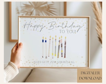 May include: A printable birthday card with a gold background and a white frame. The card features a handwritten message that says "Happy Birthday to You!" and a row of candles made of rolled-up euro bills. The text "Alles Gute zum Geburtstag" is at the bottom of the card.
