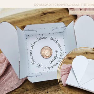 DIY-Box mit besonderem Herzverschluss, ideal zum Verschenken eines Cents als Glückssymbol für Silvester und Neujahr.