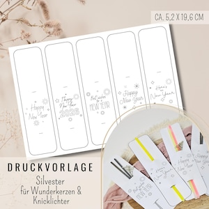 May include: White printable templates for New Year's Eve favors, with text like "Happy New Year" and "Best wishes for New Year." Each template measures approximately 2 x 7.7 inches. The design includes star and firework graphics.