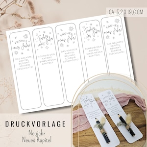 以下が含まれることがあります： 「Frohes neues Jahr」と「Das nächste Kapitel beginnt, schreib Geschichte!」と書かれた黒い文字の白いブックマークテンプレート。テンプレートのサイズは約5.2cm x 19.6cmです。画像の下部には「DRUCKVORLAGE Neujahr Neues Kapitel」と書かれています。