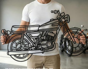 May include: A black metal wall art piece shaped like a motorcycle with detailed outlines of the wheels, engine, seat, and handlebars. The design features a hollow frame construction. The text "WE TURN YOUR MOTORCYCLE INTO METAL ART" is visible.