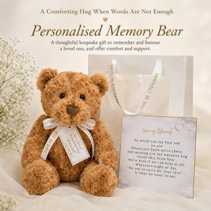 May include: A brown plush teddy bear with a white ribbon printed with the text Love Is Eternal and a tag reading Remembering Daniel 1940-2023. Beside it is a white gift bag and a card with the text Love Is Eternal and a poem about loss and comfort.
