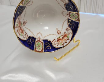Taza de té de porcelana toscana con diseño floral de cobalto e imari, ribete dorado y festoneado. Fabricada en Inglaterra.