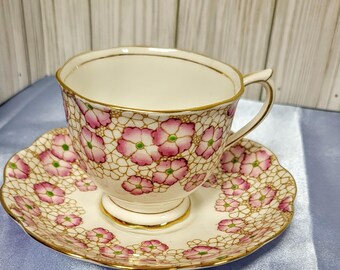 Theekop en schotel van Royal Albert, roze chintz-gouden latwerk uit de jaren 1930, Engels Bone China