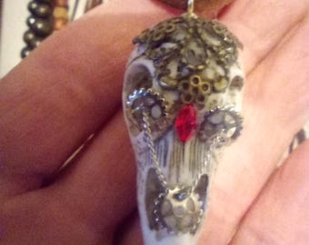 raven skull necklace, possibly crow, possibly acrylic, with adornments and leather cord