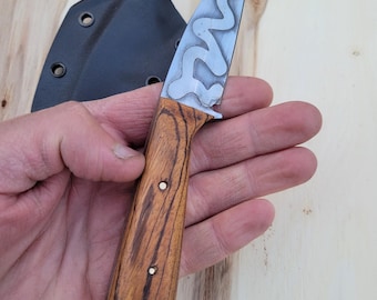 Boat knife, Wharncliffe point, mustard etch, zebrawood handle, kydex sheath with belt clip.