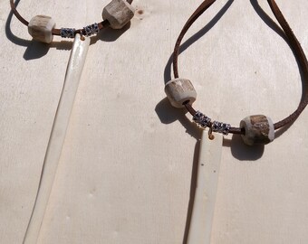 Camel bone pendant necklaces, with antler beads and leather cord.