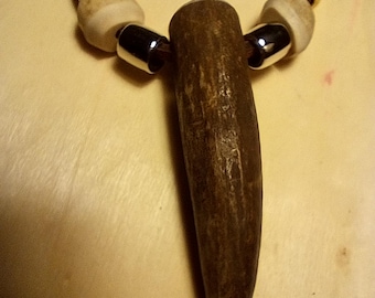 Deer antler tip necklaces, with antler beads and leather cord.