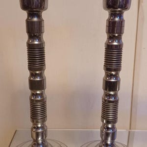 A pair of Antique 1920s Art Deco English Turned Chrome Candlesticks