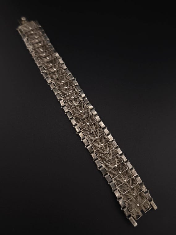 Articulated bracelet in solid silver. - image 1