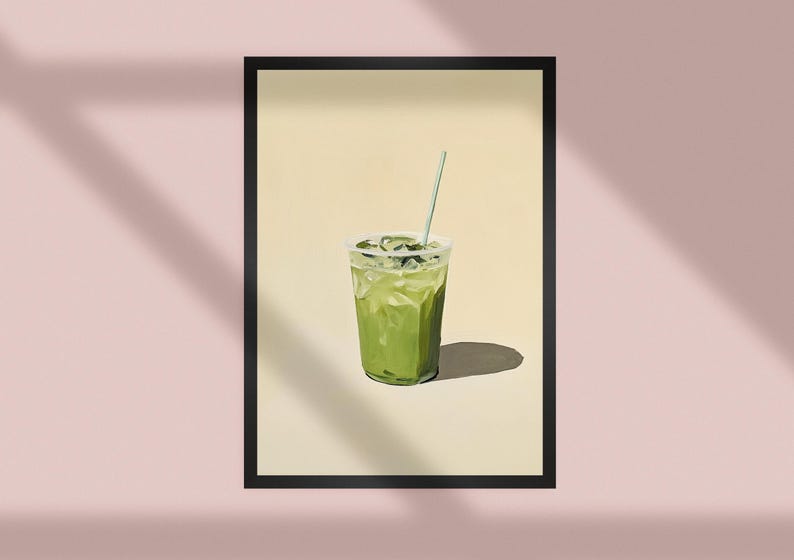 May include: A green iced drink with a straw in a clear plastic cup. The drink is on a light yellow background.