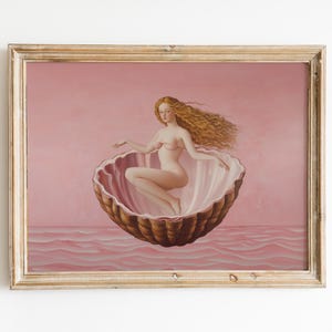 May include: A painting of a woman with long blonde hair sitting in a large seashell. The woman is wearing a pink seashell bra and is sitting on a pink and brown seashell. The background is a pink sky with a pink ocean.
