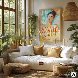 May include: A living room scene with a large framed artwork featuring a woman with closed eyes. The room includes a white sofa with pillows, woven ottomans, and potted plants. The text "FRAME MOCKUP" is displayed in gold.