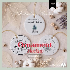 May include: Three white circular ceramic ornaments with gold hanging strings. The top ornament features a pine tree graphic and text. The bottom left ornament has a dotted border and text. The bottom right ornament displays a line art graphic and text.